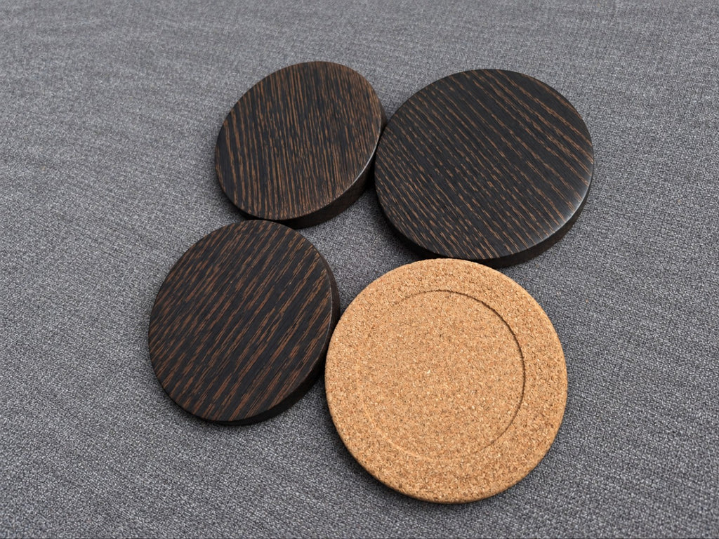 Bronze grain ebonised oak coasters alongside a view of the fitted cork backing