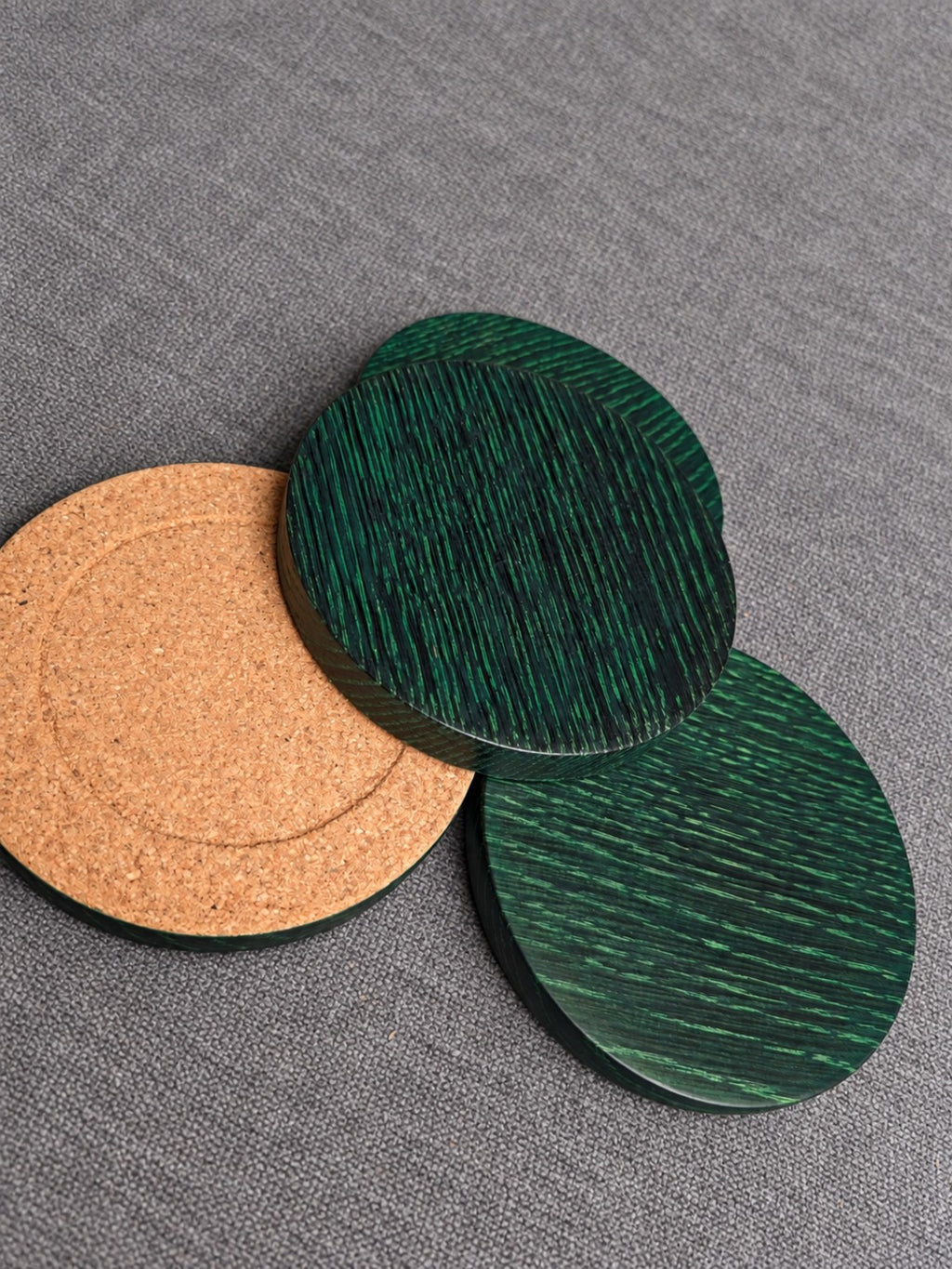 Green grain ebonised oak coasters with the cork backing visible