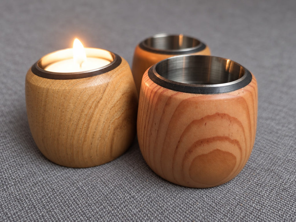 Cedar, Douglas fir and oak tealight trio arranged together with a candle lit in one holder