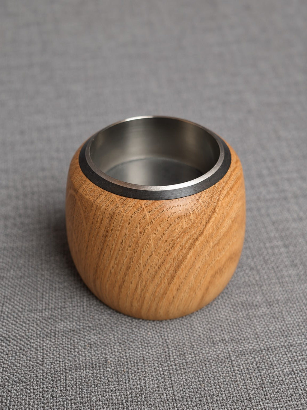 Oak holder from the mixed wood tealight trio, showing its grain and fitted stainless steel insert