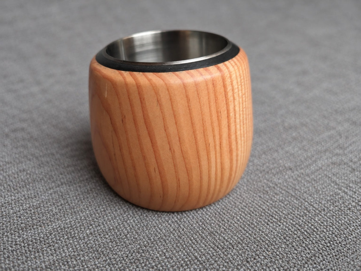 Close view of the warm pink and orange grain on a softwood holder from the trio